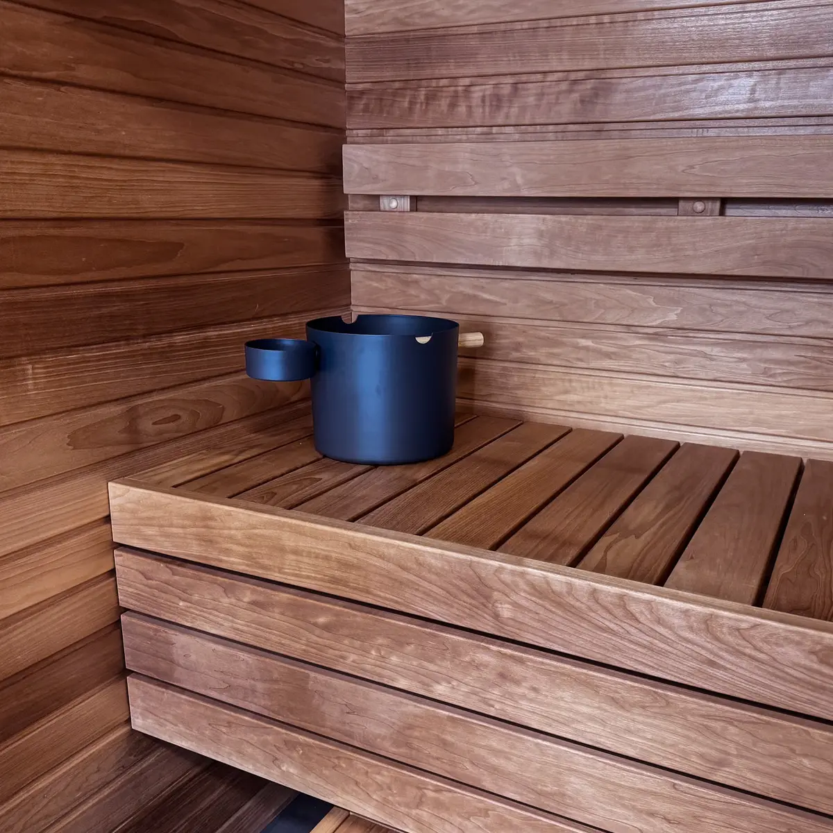 Close view of ProSaunas thermo-aspen sauna walls, backrest, and bench boards